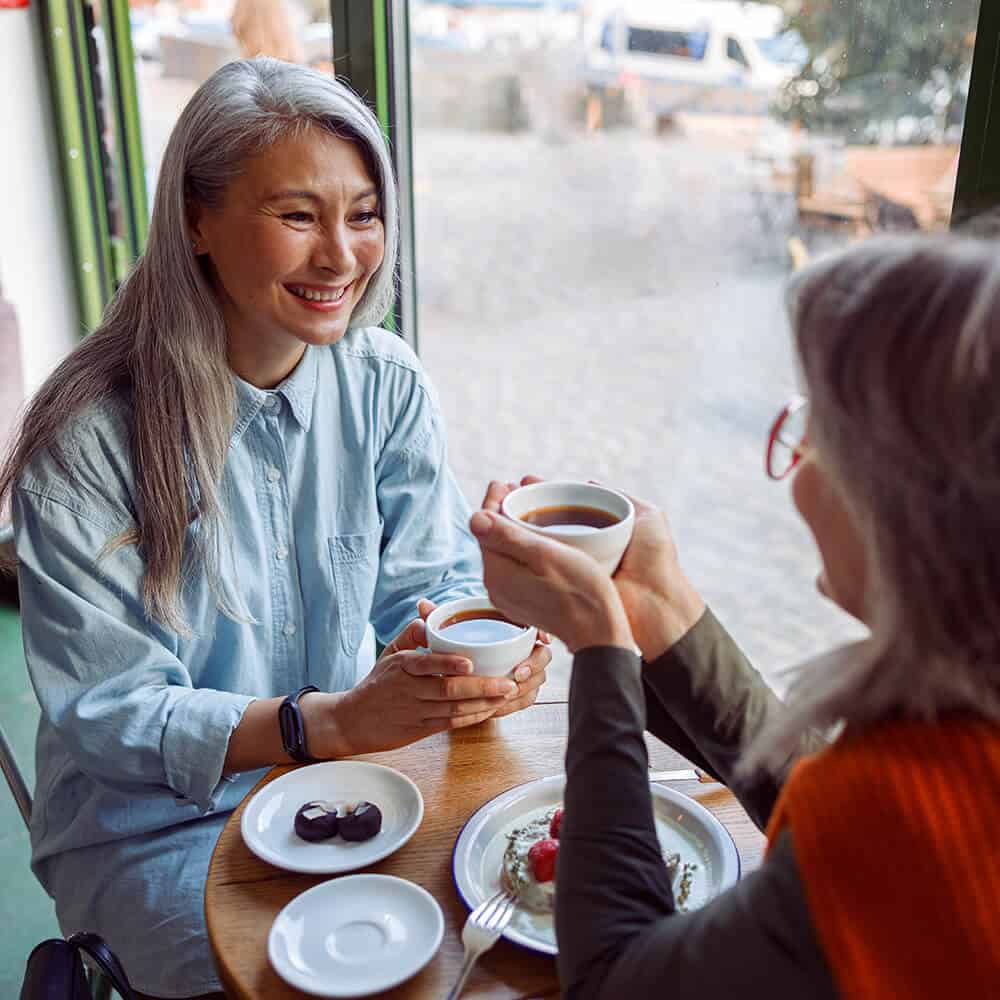 Two Women Talking at a Coffee Shop